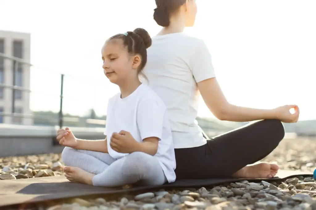 A Child and a female on meditation while on Mindfulness-Based Family Therapy at Transformation Health Services in Virginia Beach, VA