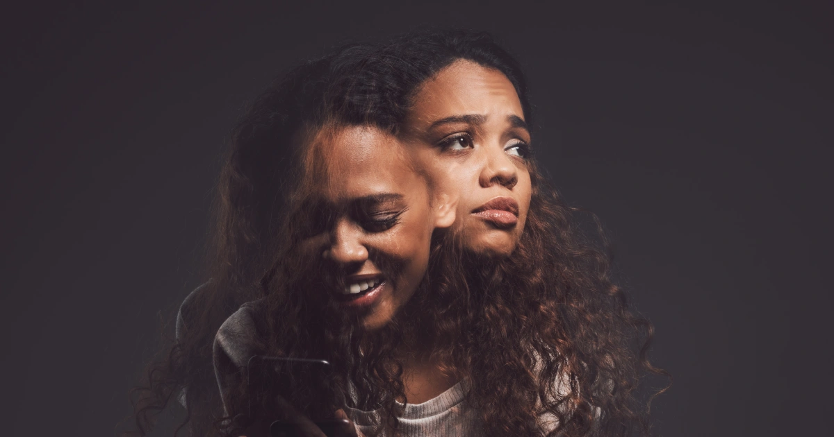 Woman showing mixed emotions representing bipolar disorder support with Transformation Health Services