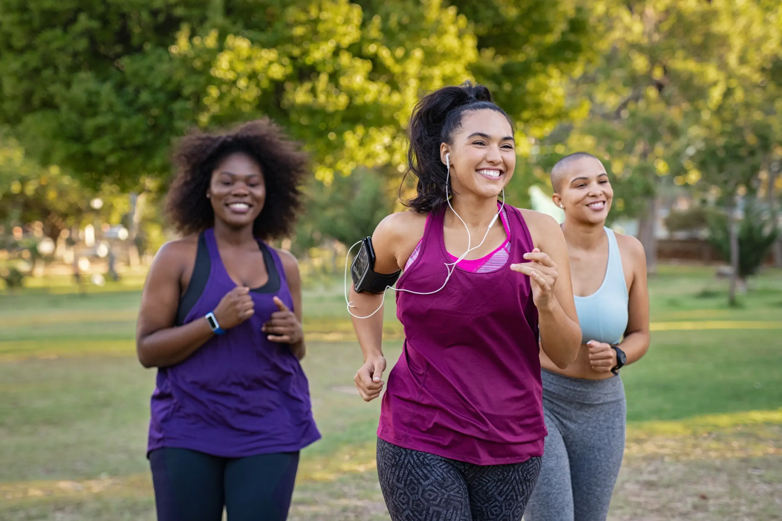 A group of females doing jogging outside and looking happy after Medical Weight Management at Transformation Health Services